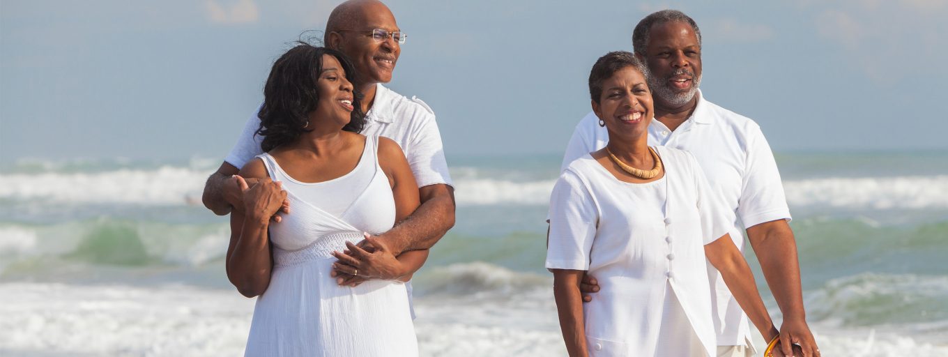 Two healthy, vibrant couples standing together